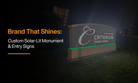 Illuminated monument entry sign powered by custom solar lighting, showcasing off-grid LED sign solutions for commercial properties and housing communities.