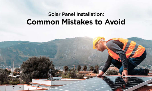 men installing solar panel on roof