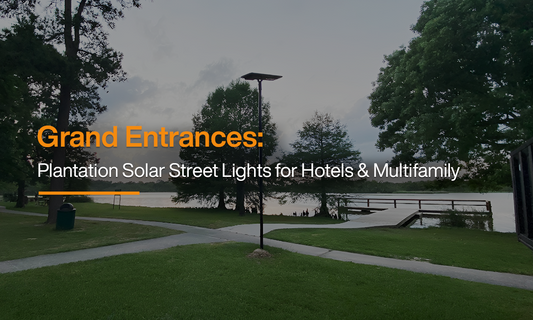Plantation solar street light illuminating a landscaped outdoor entrance near a lake, designed for hotels, resorts, and multifamily properties.